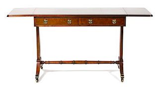 A Regency Style Mahogany Drop-Leaf Sofa Table Height 29 x width 48 x depth 20 inches.