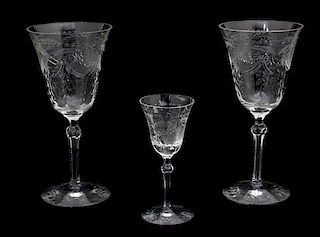 Twenty-Three Etched and Wheel Cut Stemmed Water Goblets and Cordial Height of tallest 7 5/8 inches.