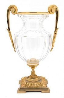 A French Crystal and Gilt Metal Urn Height 18 x width 11 x depth 8 inches.