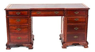 A Chippendale Style Mahogany Pedestal Desk Height 30 1/2 x width 61 x depth 20 1/4 inches.