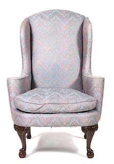 A Chippendale Style Mahogany Upholstered Wing Chairs Height 46 inches.