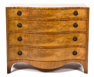 A Hepplewhite Style Walnut Serpentine Chest of Four Drawers Height 34 1/2 x width 42 x depth 22 inches.
