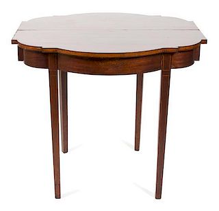 A Federal Style Mahogany Flip Top Table Height 31 x width 36 x depth 17 3/4 inches.