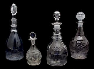 Four American Pressed and Cut Glass Decanters Height of tallest 12 1/2 inches.