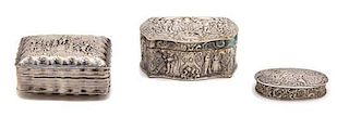 Three Continental Silver Boxes, 19th Century, one decorated with figures in gardens, one with a tavern scene with figures dan