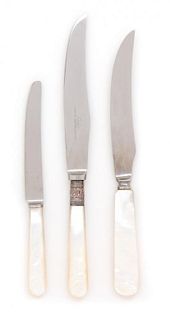 Three Sets of Mother-of-Pearl Handled Knives and Forks Length of largest 8 1/4 inches.