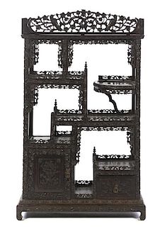 A Chinese Carved Hardwood Display Etagere, Height 60 1/2 x 36 x 15 3/4 inches.