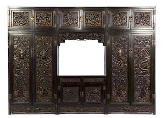 A Chinese Carved Wood Three-Part Cabinet, Height 86 x width 39 1/4 x depth 15 3/4 inches.
