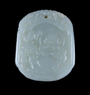 A Chinese Carved Celadon Jade Pendant with Buddha Relief. Light in color with russet streaks. Good