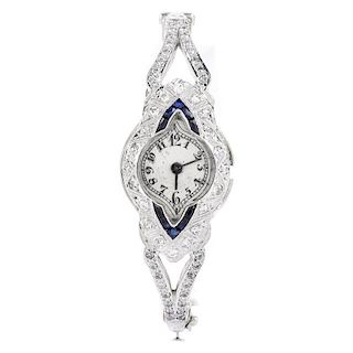 Art Deco Diamond, Sapphire and Platinum Bangle Bracelet Watch. Unsigned. Watch needs stem put back