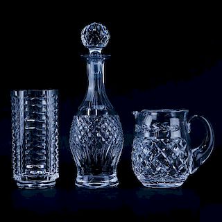 Three (3) Waterford Crystal Tableware. Includes: decanter, pitcher, and cylindrical vase. All signe