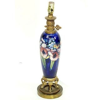 A Moorcroft Iris Pottery Vase Mounted as Lamp. Good condition. Overall measures 21-1/2" H. Shipping