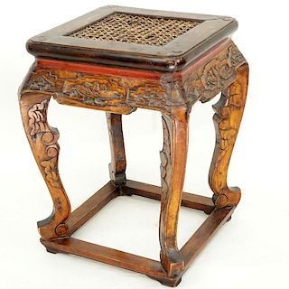 Chinese Carved Wood Stool with Cane Top. Splits to wood and rubbing, stains to top, repairs, wear t