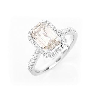 Approx. 2.10 Carat Emerald Cut Diamond and 18 Karat White Gold Engagement Ring accented throughout
