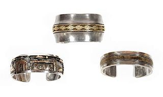 Three Southwestern Silver and 14 Karat Gold Cuff Bracelets Length of first 5 1/4 x opening 7/8 x width 5/8 inches