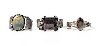 Three Southwestern Silver and Agate Cuff Bracelets Length of one 6 x opening 1 1/4 x width 1 1/2 inches