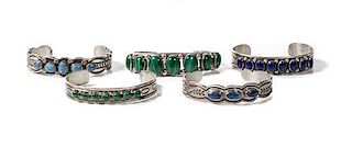 Five Navajo Silver and Varying Stone Bracelets Length of one 5 3/8 x opening 1 x width 5/8 inches