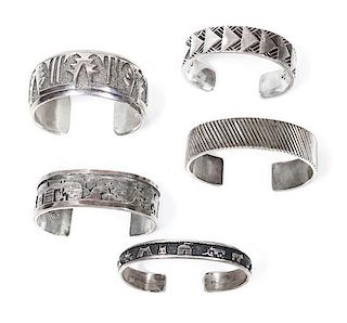 Five Southwestern Silver Bracelets Length of first 5 7/8 x opening 3/4 x width 3/8 inches