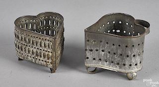 Two punched tin heart form cheese strainers