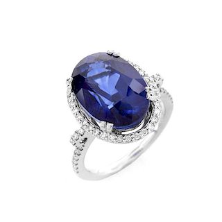 Oval Cut Sapphire, Diamond and 14 Karat White Gold Ring. Sapphire with vivid violet blue color, mea