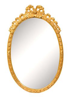 A Continental Neoclassical Style Giltwood Mirror Height 38 x width 22 ½ inches.
