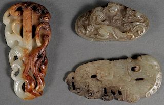 A GROUP OF THREE CHINESE CARVED JADE PENDANTS