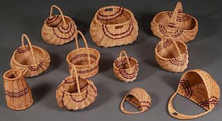 A GROUP OF ELEVEN WOVEN BASKETS