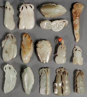 A GROUP OF FIFTEEN CHINESE CARVED JADE FIGURES