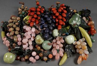 A GROUP OF CHINESE CARVED HARDSTONE FRUIT