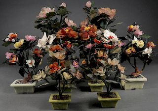 EIGHT CHINESE HARDSTONE CARVED FLORAL GROUPINGS
