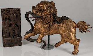 A CHINESE CARVED AND GILT WOOD FOO LION