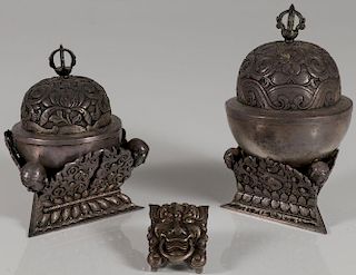A PAIR OF TIBETAN SILVER COVERED VESSELS