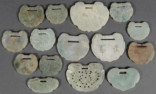 A GROUP OF FIFTEEN CHINESE CARVED JADE PENDANTS