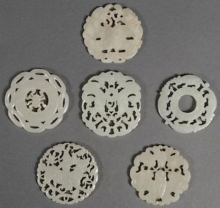 A GROUP OF SIX CHINESE CARVED JADE PENDANT DISCS