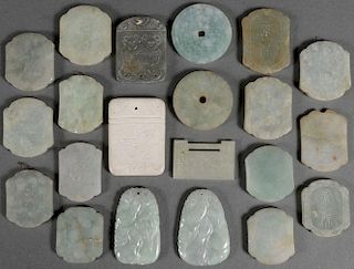 A GROUP OF TWENTY CHINESE CARVED JADE PENDANTS