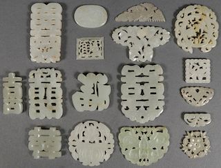 A GROUP OF SEVENTEEN CHINESE CARVED JADE PENDANTS