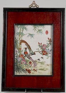 A CHINESE FAMILLE ROSE DECORATED PORCELAIN PLAQUE