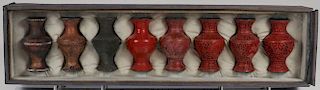 A CHINESE CASED CINNABAR PRODUCTION SET