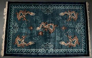 A CHINESE SCULPTED DRAGON RUG