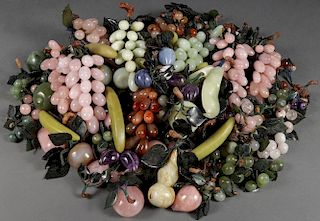 A GROUP OF CHINESE CARVED HARDSTONE FRUIT