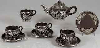 A CHINESE CERAMIC AND METAL OVERLAY TEA SET