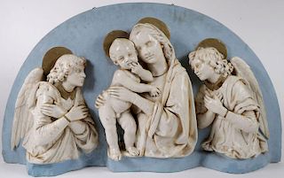 A CAST ARCHED PLAQUE OF THE VIRGIN AND CHILD