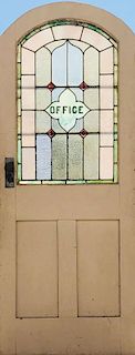 A WOOD DOOR WITH LEADED GLASS "OFFICE WINDOW"