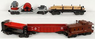 A GROUP OF TOY TRAINS AND ACCESSORIES