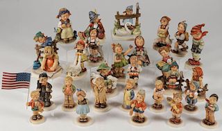 A GROUP OF 48 HUMMEL FIGURINES
