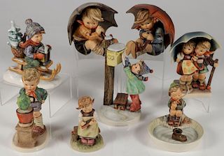 A GROUP OF 27 HUMMEL FIGURINES