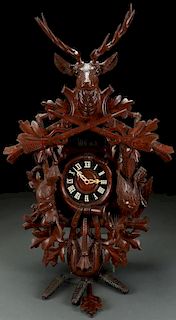 A GERMAN "BLACK FOREST" STYLE CUCKOO CLOCK