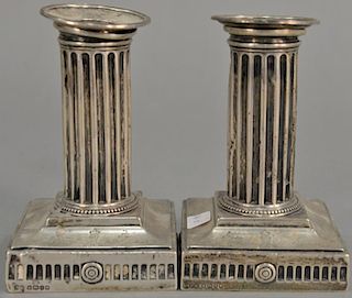 Pair of Elkington & Co. weighted sterling silver candlesticks, marked "From the Junior Subaltern to the Adjutant". ht. 5in.  