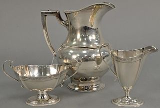 Three piece lot to include sterling silver pitcher (ht. 8 in.), Hardy Bros. Ltd. sugar and creamer. 25.5 troy ounces   Proven