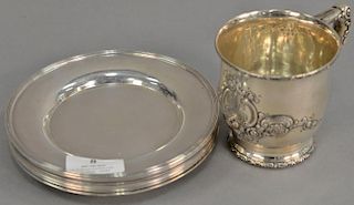 Nine piece lot to include eight bread plates (dia. 6in.) and Theodore Starr mug (ht. 3 1/2in.). 34.2 troy ounces